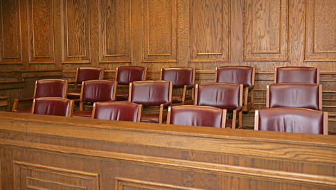 empty chairs in a jury box
